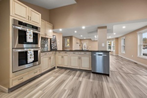 The minute you walk through the front door you are in awe of the open kitchen/living area with updated cabinets, incredible gas range, and lots of storage with large door onto the patio garden area leading to the garage/shop. Click here for details.